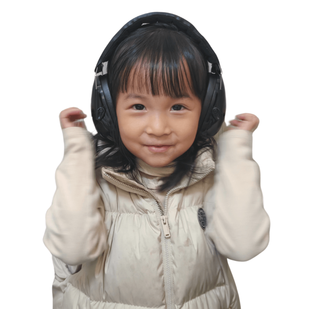 front view of a kid wearing black ear defender