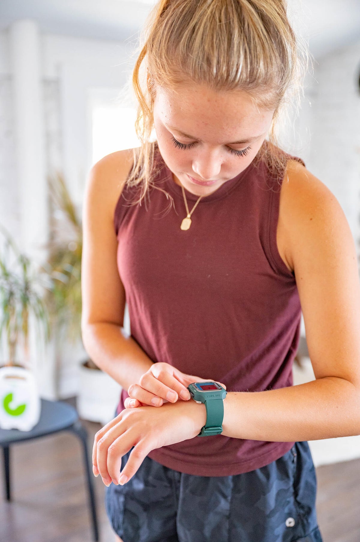 girl adjusting the modes of time timer watch