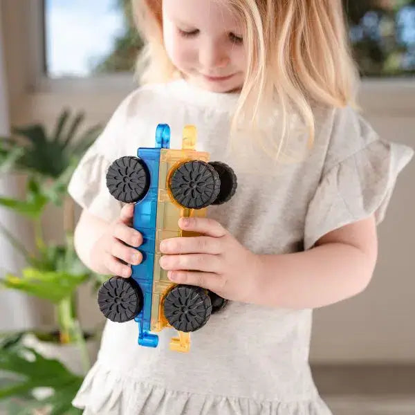 girl playing with the 2 piece car pack