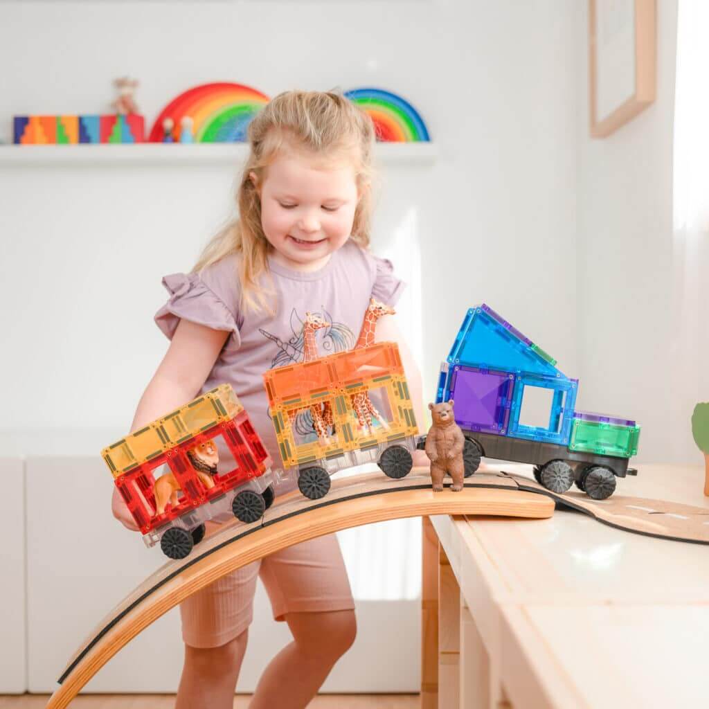 kid playing the transport pack in a kinder-board