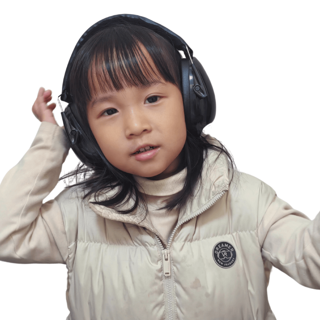 kid posing while wearing black ear defender