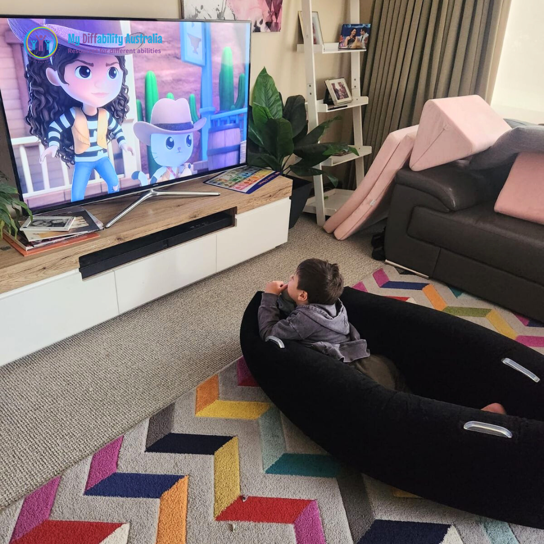 kids watching tv while inside the sensory peapod