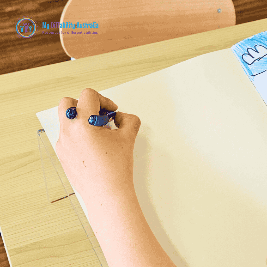one hand in a writing position using the twist n write pencil while the paper is placed in the acrylic board