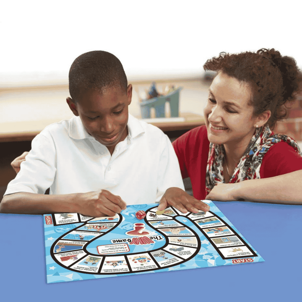 pictue of a teacher guiding a young boy while playing 6 Comprehension Games
