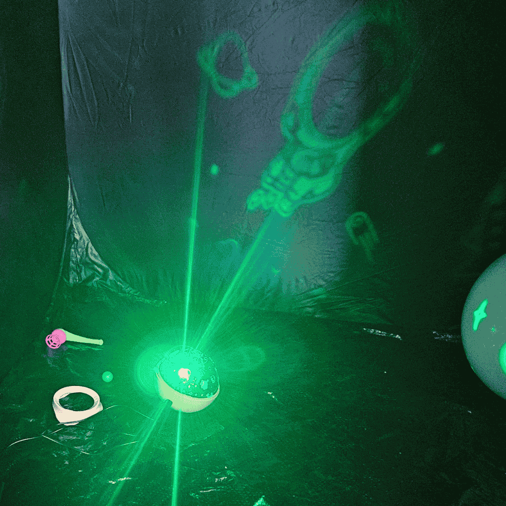 zoom in view of rotating star projector inside a dark den