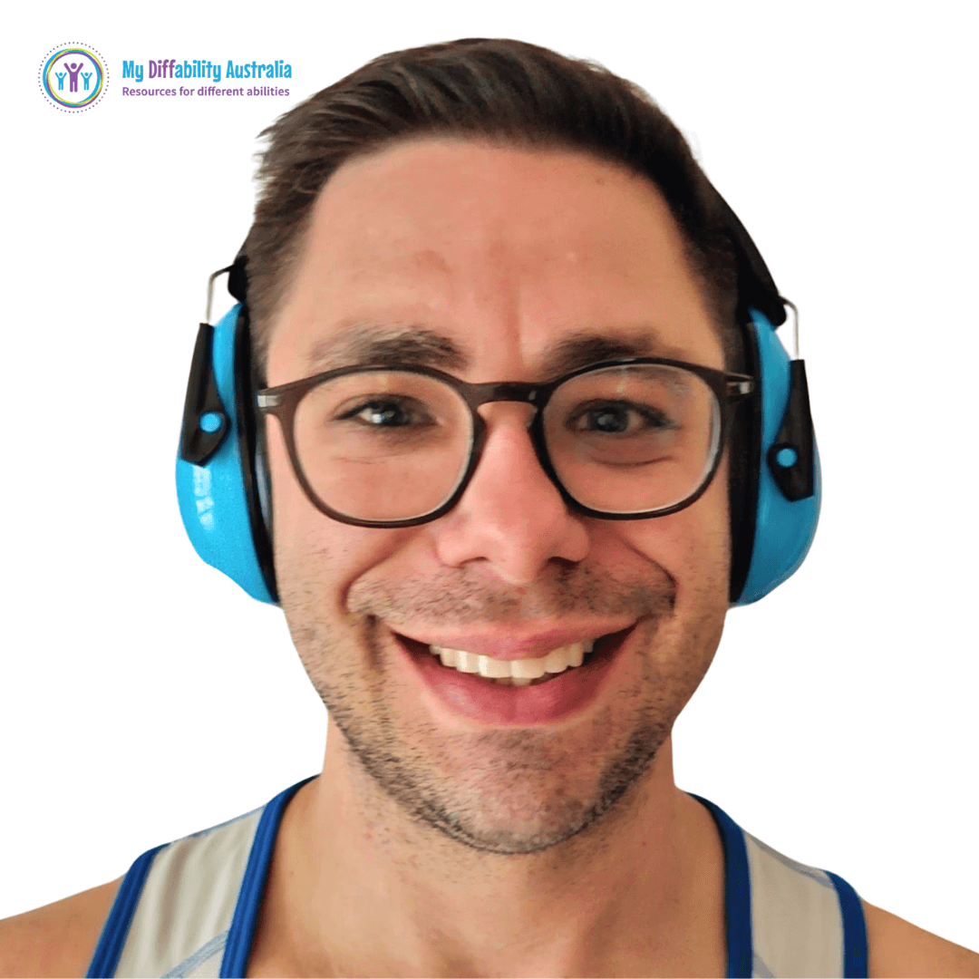 Adult wearing sensory ear muffs