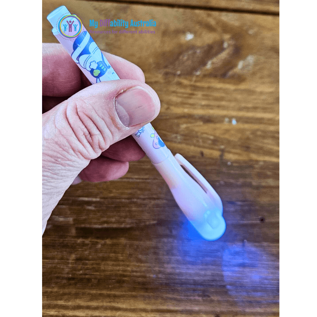 uv invisible spy pen side view while being hold by one hand