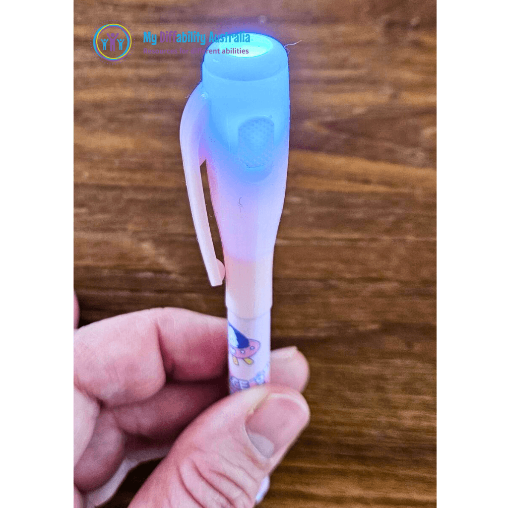 uv invisible spy pen while turned on zoom out pink