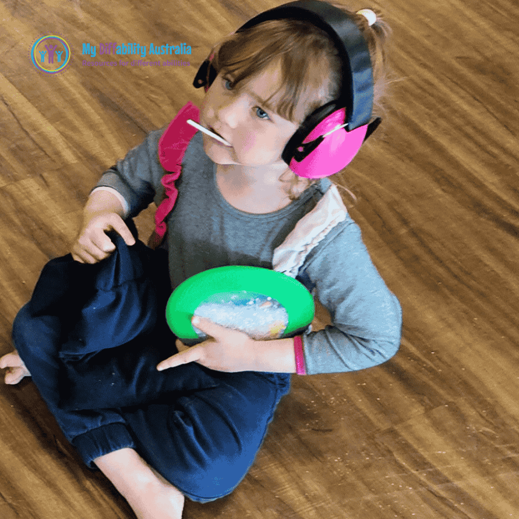 young girl with weighted lap blanket on her lap