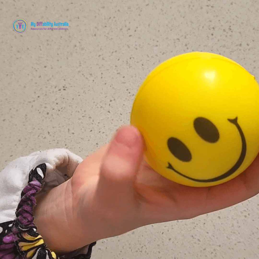 Holding Smiley Squishy de stress ball