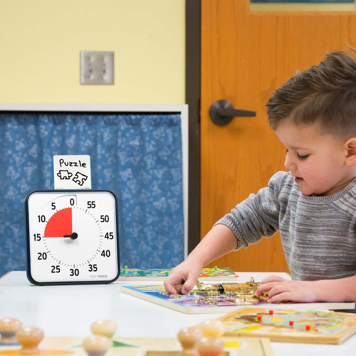 Young boy using Time Timer 8 as a Classroom time Support resource