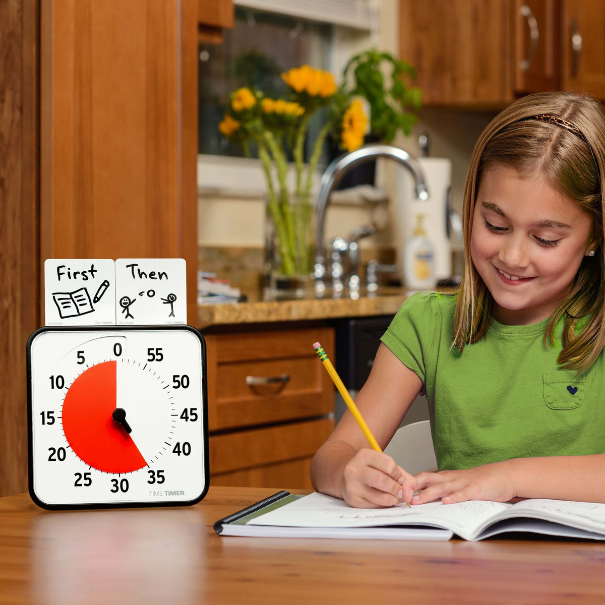 Young Girl using Time Timer 8 during Therapy Support session of writing practice.