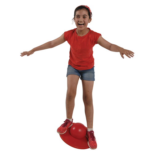 kid using a red lolo ball balancing on it